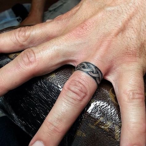 Celtic Knot Ring Tattoo, Ring Tattoo Designs For Man, Mens Ring Tattoo Wedding, Ring Tattoos Men, Men’s Wedding Band Tattoo, Tattoo Rings For Men, Mens Ring Tattoo, Ring Tattoo For Men, Finger Ring Tattoo