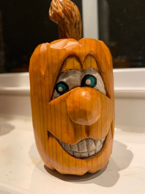 This pumpkin is similar in design and character as our previous animated carved pumpkins; however, Mike is using a different technique using walnut finishing oil & feed-n-wax to enhance the natural wood & grain of the finished product.     This new technique is also being utilized in the Santa head ornaments and stained angels listed. Pictures don't give the items true credit for their beauty and amazing quality. When you order any listing, we will clarify if you are wanting the painted or grain enhanced version. Sculpture Dremel, Carve A Turkey, Wood Cravings, Halloween Carvings, Art Sculpture En Bois, Mushroom People, Woodcarving Ideas, Carving A Turkey, Chainsaw Wood Carving