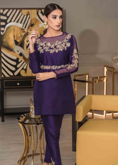 Includes: Shirt Pants Fabric: Raw Silk Color: Purple Work Technique: Embroidery Description: A glamorous and elegant “Deep Purple’ outfit enlivened with delicate gold and silver embroidery featuring dabka and sitara work on the neck and edges of the sleeves, with a sleek and modish cut, a belt wrapped along and paired with straight cigarette pants in pure raw silk fabric from our collection “Chaudhvin Ka Chand” our 'Luxury Pret Collection’. We are just in love with this color. This makes it a pe Deep Purple Outfit, Gold And Silver Embroidery, Sitara Work, Purple Outfit, Raw Silk Fabric, Silver Embroidery, Denim Maxi Dress, Purple Outfits, Simple Pakistani Dresses