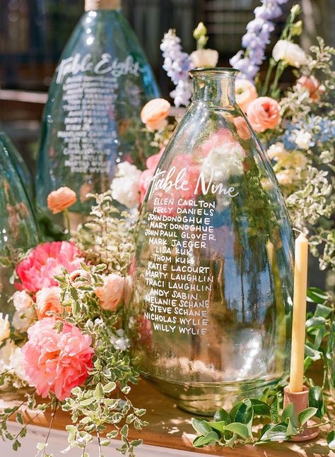 Vase Table Seating Chart, Lake Wedding Alter Ideas, Unique Table Chart Wedding, Table Assignment Display, Unique Table Assignments Wedding, Fun Wedding Seating Chart Ideas, Destination Seating Chart, Wedding Guest Seating Chart Display, Wedding Table Assignment Ideas