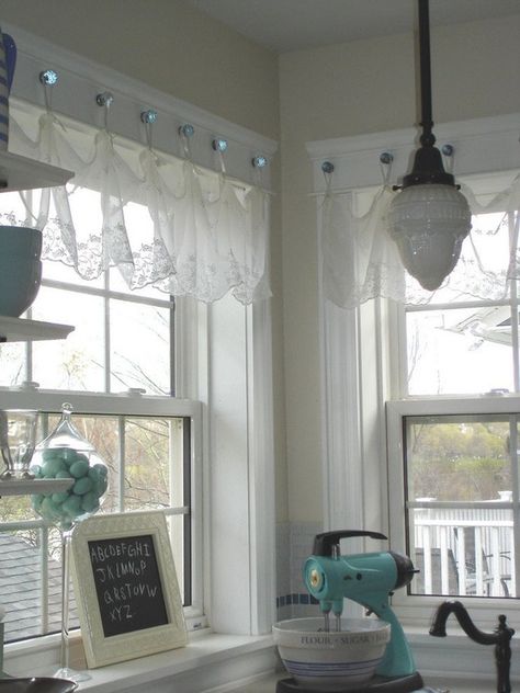 This photo from Restyled Home (via Houzz) shows glass knobs installed on the window frame from which to hang curtains. Curtain Hangers, Cute Curtains, Eclectic Kitchen, Cottage Shabby Chic, Kitchen Window Treatments, Valance Window Treatments, Window Dressing, Bedroom Windows, Lace Curtains