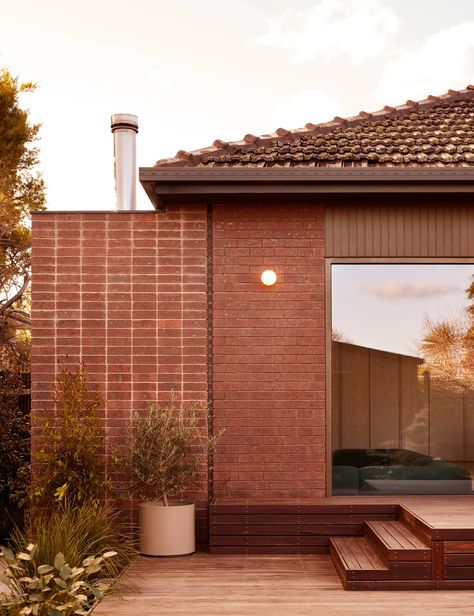 A Charming Renovation Of A 1970s Suburban Brown Brick Home Brick Bungalow Exterior, Brown Brick Houses, Hip Roof Design, Suburban Home, Tile Renovation, Recycled Brick, Brown Brick, Bungalow Renovation, Brick Exterior House