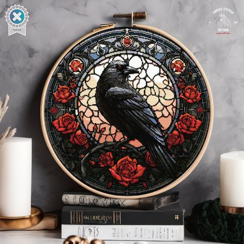 Elevate your cross-stitch collection with our "Gothic Raven and Roses" pattern. This design showcases a majestic raven set against a stunning stained-glass backdrop, adorned with vibrant red roses. The intricate details and rich colors create a perfect blend of elegance and mystery, making it a captivating piece for your home decor or a unique gift for loved ones. Ideal for both novice and experienced cross-stitchers, this pattern brings a touch of gothic charm and artistic beauty to your embroi Wheel Of Time Cross Stitch, Gothic Embroidery Patterns Free, Cross Stitch Raven, Gothic Embroidery Design, Gothic Embroidery Patterns, Stained Glass Embroidery, Gothic Cross Stitch Patterns, Witchy Cross Stitch Patterns, Crow Embroidery