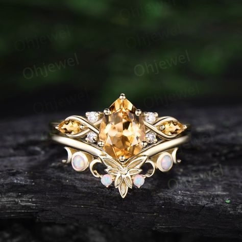 "This is a citrine engagement ring in solid gold,about 6x8mm pear cut. The accent stones are round 1.5mm moissanites and marquise cut 2x4mm citrines. The matching band stones are round lab opals. The band width about 1.3-1.4mm. It can be made in any ring size. However please contact me to custom make it to a special big or small size. It can be made in white gold,rose gold or yellow gold with 14k or 18k. However for some people who are nickel allergic,I can also make it to 925 sterling silver to make you can wear it. The ring is handmade,very high quality! 30 days money back guarantee. Returns & Warranty 30-Day money back guarantee (starting from the day of delivery). \"Made to Order\" purchases qualify for our 30-day money back guarantee. The 30-day money back guarantee gives you time to Citrine Engagement Ring, Citrine Wedding Ring, Citrine Wedding, Citrine Ring Engagement, Promise Ring Set, Tiaras Jewellery, Opal Wedding Rings, Wedding Promises, Cute Engagement Rings