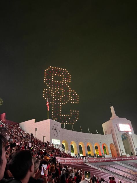 SC. Southern California. LA Coliseum. USC football game. Night. Drones. College football stadium Usc Gould Law, Usc Football Aesthetic, Usc University Aesthetic, Usc College Aesthetic, Usc Aesthetic Wallpaper, University Of Southern California Aesthetic, Usc Aesthetic Campus, Usc Grad Cap, College In California