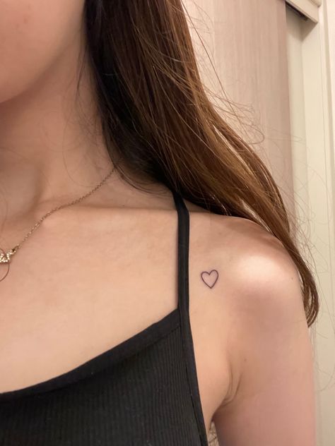 Front Shoulder Heart Tattoo, Shoulder Heart Tattoos For Women, Heart Tattoo Shoulder Small, Heart Tattoo On Shoulder For Women, Simplistic Heart Tattoo, Tiny Heart Tattoo Shoulder, Collarbone Tattoo Aesthetic, Filled In Heart Tattoo, Heart On Shoulder Tattoo