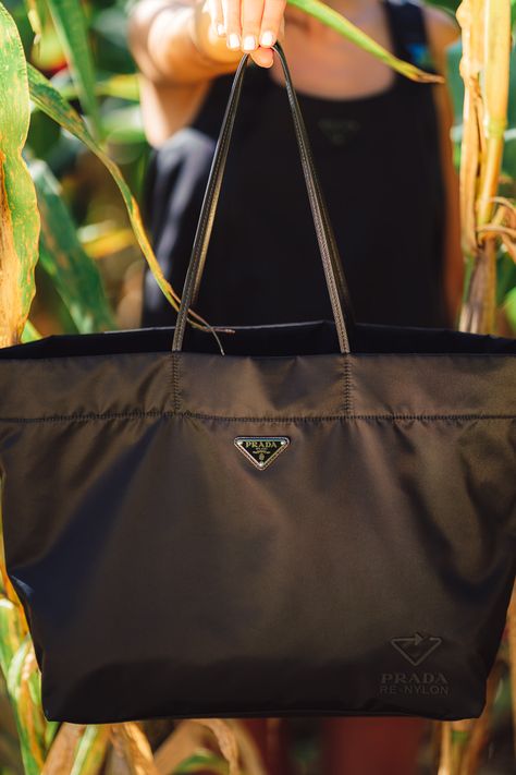 Prada Re-Nylon Brings Sustainability to the Brand’s Most Recognizable Signifier: Nylon - PurseBlog Prada Big Bags, Big Prada Bag, Prada Nylon Bag Outfit, Prada Nylon Tote Bag, Prada Bag Outfit, Prada Nylon Bag, Tote Bag Outfit, Prada Tote Bag, Sustainable Bag