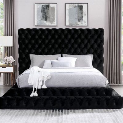 This is a dramatically oversized headboard with a fully upholstered frame design that takes the centre stage of your bedroom. Entirely upholstered in luxurious flannelette, this piece instantly becomes a focal point. This bed is adorned with deep button tufting for an extra level of glitz and glam. The lower profile allows for a step-up design that's fit for a glam-styled bedroom decor. | Rosdorf Park Micexehan Tufted Standard Bed w/ Mattress Black 59.4 x 85.0 x 98.4 in | C008991696_1808505723 | Black Upholstered Bed, Black Platform Bed, Black Queen Bed, King Upholstered Platform Bed, Upholstered Bedroom Set, Tufted Platform Bed, Platform Bedroom Sets, Black Bed, Eastern King Bed