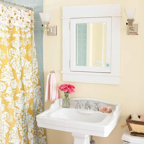 The blue-gray tile in this bathroom is pretty much identical to ours - great color combo with the pale yellow! England Bathroom, Painted Beadboard, Bungalow Bathroom, Beadboard Bathroom, Cottage Bath, Yellow Shower Curtains, Southern Living House Plans, Yellow Bathroom, Console Sink