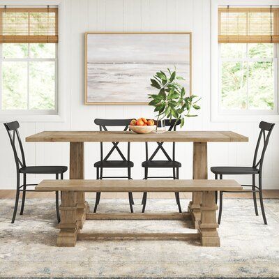 Gather your family around this 6-piece dining set and bring coastal farmhouse charm to your dining room. Two side chairs, a bench, and a rectangular table are included. The bench echoes the look of the trestle table thanks to square pedestal columns and a long rectangular seat. They're also made from solid and engineered wood with a brown finish that's distressed to highlight the natural wood grain. The dining chairs offer a classic slat back design and are crafted from steel in a black hue for Modern Farmhouse Dining Table And Chairs, Kitchen Table With Bench Seating, Farmhouse Table And Chairs, Square Dining Room Table, Modern Farmhouse Dining Table, Future Farmhouse, Dining Table For 6, Kitchen Table Bench, Coastal Dining Room