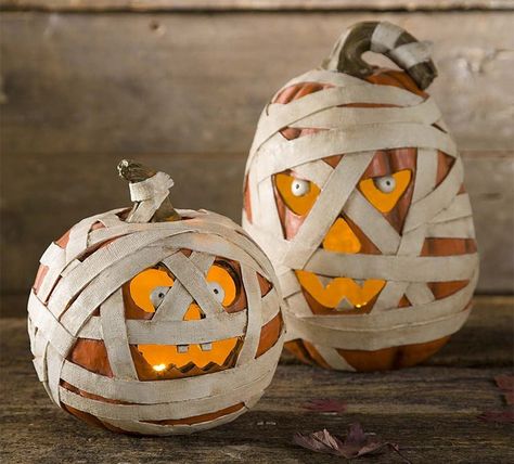 These seemingly undead gourds make look like real pumpkins wrapped up in tattered mummy bandages, but they're actually made… Jack O Lantern Decorations, Lantern Decorations, Mummy Pumpkin, Pumpkin Mummy, Pumpkin Carving Designs, Halloween Mummy, Halloween Jack O Lanterns, Pumpkin Jack, Halloween Lights