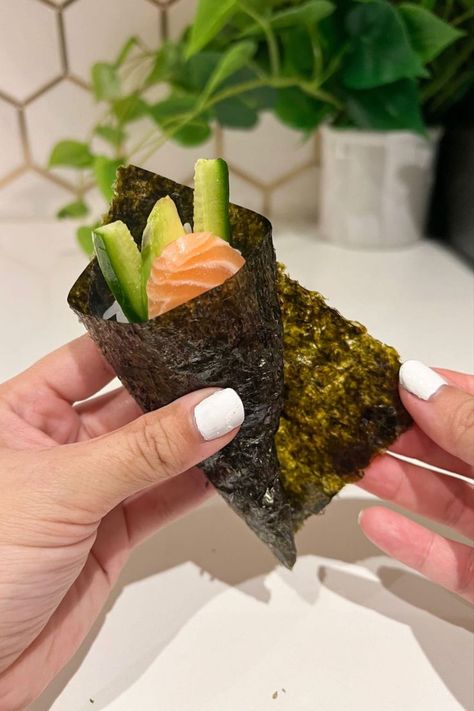 Homemade Sushi Hand Roll with raw sushi-grade salmon, cucumber slices, sushi rice, and roasted seaweed nori. Perfect for sushi night at home. Sushi Ingredients, Diy Sushi, Sushi At Home, Nori Seaweed, Mini Cucumbers, Austin Food, Carrot And Ginger, Asian Grocery, Sushi Rice