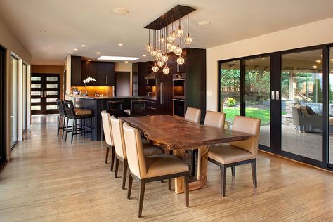 Midcentury modern dining room taps into the raw beauty of a live edge table [Design: Giulietti Schouten Architects] Dapur Moden, Kitchen And Dining Room Lighting, Door Lighting, Wood Slab Dining Table, Dining Light Fixtures, Modern Dining Room Lighting, Dining Table Lighting, Set Meja Makan, Dining Room Contemporary