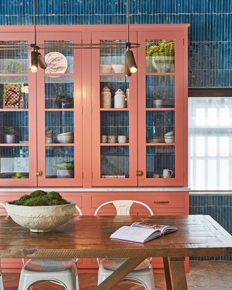 Behind the scenes - Tiling behind glazed cabinets can unite elements of a kitchen design to create a more cohesive and interesting look. Here, @blakesldn have created a wonderful contrast between the blue tiles on the wall and the vibrant coral cabinets in front. Would you try this in your kitchen? . Photography by Philip Durrant . See more colorful kitchen tile ideas at the link in bio. . #homesandgardens #kitchen #tiles Coral Cabinets, Colorful Kitchen Tile, Kitchen Tile Ideas, Glazed Cabinets, Blakes London, Kitchen Photography, Colorful Kitchen, Shaker Kitchen, Kitchen Tile