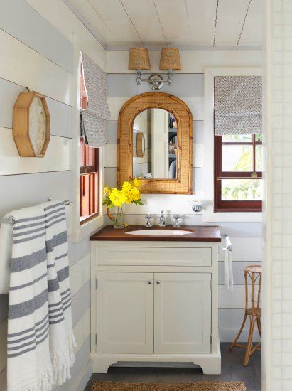 The powder room is narrow, but it feels more spacious because of the rows of mirrors placed on each opposing wall. .  #bathroomtileideas House Decor Bathroom, Beach Cottage Style Decor, Beach Style House, Beach House Tour, Beach House Bathroom, Bathroom Beach, Beach Bathroom Decor, Harbour Island, Beach Cottage Decor