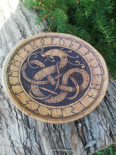 Dimensions: 22x3 cm Hand carved wooden plate with hand burned nordic ornament with Futhark. The shade of wood color may vary depending on the drawing of the wood and its growing conditions Shield Drawing, Norse Dragon, Viking Ornament, Dragon Plate, Viking Decor, Viking Dragon, Viking Shield, Futhark Runes, Pyrography Art