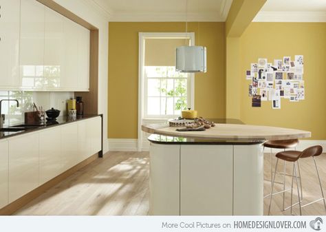 A Collection of 15 Kitchen Paint Ideas | Home Design Lover Yellow Kitchen Paint, Mustard Kitchen, Curved Kitchen Island, Cream Kitchen Cabinets, Curved Kitchen, Gloss Kitchen, Kitchen Wall Colors, Kitchen Colour Schemes, Yellow Kitchen