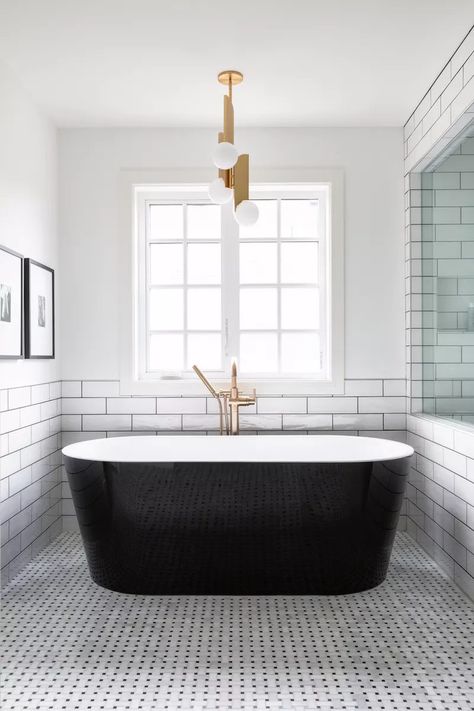 Black and white decor is a classic color scheme that stretches across styles, from modern farmhouse to midcentury modern. Give a room in your home some balance with contrast by checking out these stunning black and white décor ideas. Stand Alone Bath Tub, Black Bathtub, Black Tub, Subway Tiles Bathroom, Stand Alone Tub, Modern Bathtub, White Tub, Bathtub Design, Black And White Decor