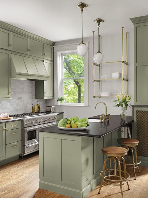 The homeowners originally requested an all white kitchen. As the layout came together Smith threw the couple a curve ball and suggested a nature-inspired, green color for the cabinetry. “To my surprise, they loved the idea,” she says. “The green still reads very neutral but introduced a little something extra. Sometimes it reads gray, sometimes olive or sage.” Modern Kitchen Shelves, Green Kitchen Cabinet, Two Toned Kitchen Cabinets, Olive Green Kitchen, Cabinet Trends, Sage Kitchen, Kitchen Cabinet Trends, Sage Green Kitchen, Trends 2025