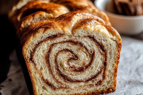 Oh, where do I even begin with this **Cinnamon Swirl Bread**? Just the thought of baking a loaf and filling the kitchen with that irresistible aroma makes me giddy like a kid on Christmas morning! This recipe is close to my heart—I remember the first time I baked this fluffy delight with my grandma. We spent hours in the kitchen measuring and mixing, listening to her stories while waiting for the dough to rise. It’s a joyous memory that lingers every time I make this bread. What I love about th Cinnamon Swirl Loaf Bread, Amish Cinnamon Swirl Bread, Best Cinnamon Bread Recipe, Cinnamon Swirl Yeast Bread Recipe, Cinnamon Breakfast Bread, Cinnamon Roll Bread Loaf, Homemade Cinnamon Swirl Bread, Healthy Cinnamon Bread, Bread Maker Cinnamon Rolls