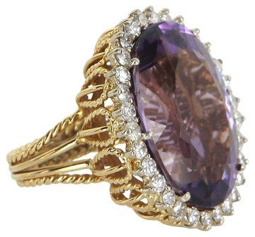 Large Amethyst Diamond Cocktail Ring crafted in 18 karat yellow Gold. Weight: 14.7 grams. Faceted oval-cut Amethyst measures 23mm x 16mm (estimated at 20 carats), accented with an estimated 1.20 carats of round brilliant-cut Diamonds (estimated at G-H color and SI1 clarity). The Amethyst is in excellent condition and free of cracks or chips. The ring is not hallmarked though it has tested positive for 18 karat Gold. •$2,695,00 Vintage Cocktail Ring, Diamond Cocktail Ring, Cameo Jewelry, Magical Jewelry, Diamond Cocktail Rings, Ladies Diamond Rings, Amethyst Jewelry, Bling Rings, Princess Diamond