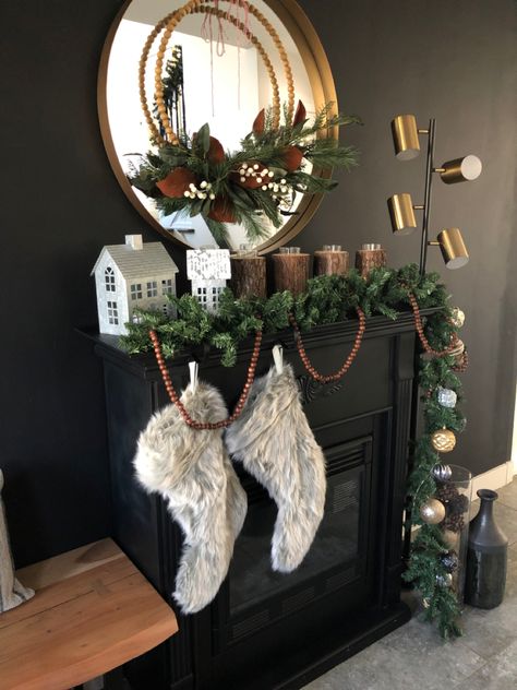 Black Fireplace Garland, Black Garland Christmas, Black Fireplace Wall Christmas, Black Wall Christmas Decor, Lighted Garland On Black Circle Mirror, Black Fireplace Christmas Decor, Black Mirror White Christmas, Fireplace Decoration Ideas, Fireplace Christmas Decorations