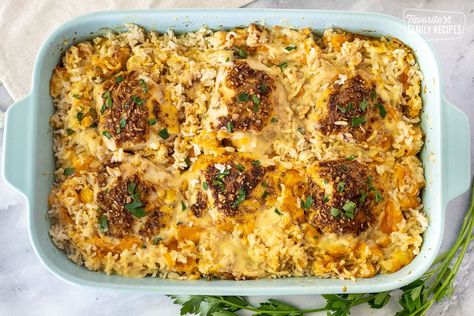 This Cheesy Chicken and Rice Casserole is made with rice, chicken breasts, cheddar cheese, cream of chicken soup, water, and seasonings. You will love this easy and delicious comfort food meal. #casserole #chickencasserole #rice #ricecasserole #cheesy #cheesycasserole #chickenandrice Chicken And Rice Recipes Oven, Lipton Chicken And Rice Casserole, Chicken And Rice Casserole Recipes Cream Of Mushroom, Chicken And Rice In Oven, Dump And Bake Cheesy Chicken And Rice, Cream Of Mushroom Chicken And Rice, Cream Of Chicken And Rice Casserole, Cheesy Chicken And Rice Casserole, Chicken Breast And Rice Recipes