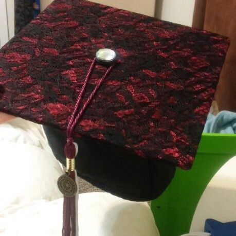 Grad cap, burgundy lace under black lace for classy and understated but unique grad cap decor. Finished off with a big shiny rhinestone on the brad for a pop! Lace Graduation Cap, Grunge Graduation Cap, Monster High Grad Cap, Twilight Grad Cap, Alt Graduation Cap, Emo Grad Cap, Goth Grad Cap, Gothic Graduation Cap, Red Grad Cap Ideas