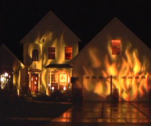 If you are not good at making props for Halloween, try decorating with light.  Here is a simple and relatively inexpensive way to make your house ... House On Fire, Dekorasi Halloween, Halloween Outside, Fire House, Crazy House, Halloween Parade, Halloween Prop, House Decorations, Halloween Yard