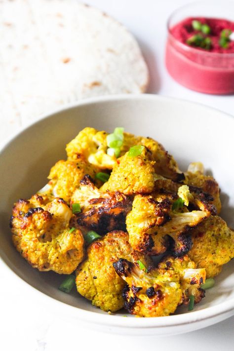 Oven roasted tandoori cauliflower (gobi / gobhi) charred and cooked to perfection. Made with simple Indian spices and ready in just 30 minutes - this is the easiest Indian vegetarian appetizer recipe that is perfect for snacking or to enjoy in wraps or over salads. #Indian #snack #healthy #vegetarian #homemade #gobi #gobhi #tandoori #charred #grilled #baked #roasted #turmeric #recipes #quick #easy #lunch #dinner #restaurant #style Tandoori Cauliflower Recipe, Cauliflower Gobi, Indian Spiced Cauliflower, Tandoori Cauliflower, Chicken Receipe, Gobi Recipes, Vegetarian Appetizer, Quick Easy Lunch, Oven Roasted Cauliflower