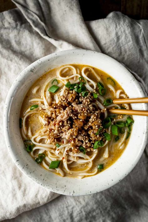 You’ll love this spicy Tan Tan Ramen with a creamy sesame broth, ground pork and ramen noodles. It’s ready in just 30 minutes and can easily be made ahead for quick weeknight dinners! Tan Tan Noodles, Ground Pork And Ramen Noodles, Creamy Ramen Broth, Ground Pork Ramen, Tantanmen Ramen, Ramen Easy, Tan Tan Ramen, Cooking With Ginger, Shio Ramen