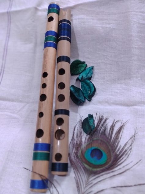 Small bamboo flute beautiful peacock feather Bard Instruments, Trinkets Aesthetic, Bamboo Flute, Beautiful Peacock, Feather Art, Photo To Video, Peacock Feather, Blue, Quick Saves