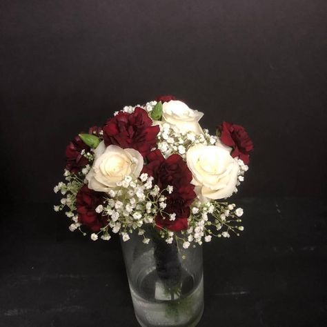 Simple bridal bouquet with 3 white roses, burgundy mini carnations and baby's breath White And Burgundy Bouquet, Bridal Bouquet White Roses, Simple Bridal Bouquet, Bouquet White Roses, Wedding Trays, White Rose Bridal Bouquet, Bridal Bouquet White, Prom Bouquet, Carnation Bouquet