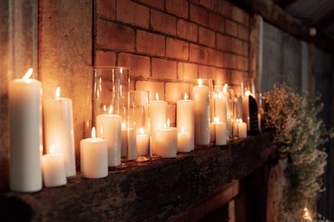 Masses of white pillar candles in a variety of sizes make a stunning fireplace mantle display for your wedding or event. Ideal as a romantic photo background for your wedding photos. Candle Pillars Dining Table, Pillar Candles Mantle, White Pillar Candles Wedding, Pillar Candles In Glass Cylinders, Mantle Candles, Ivory Pillar Candles, 6" Pillar Candle Holder, White Pillar Candles, Led Pillar Candle