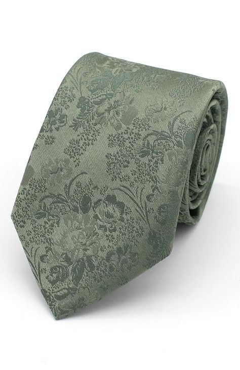 Summer wedding to go to? Or just want to add some style to your work suit. Shop our range of men's ties, ranging in style, colour and texture. This floral sage green tie, will add a fresh and stylish flare to any suit.   	7.5cm Blade Width tie  	Sage  	100% Woven Polyester Groom Sage Green Tie, Green Wedding Tie, Groom And Groomsmen Attire Sage Green, Green Suit With Tie, Sage Green Tie Wedding, Sage Green Ties Groomsmen, Sage Green Groom Suit, Sage Green Suits For Men, Groomsmen Attire Sage Green