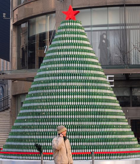 Looks like a beer drinking tree to me.. Wonder if the guy in the window drank all those bottles..Extreme Christmas Trees: 15 Outrageous Unusual Christmas Trees, Bottle Tree, Unique Christmas Trees, Tis The Season To Be Jolly, Merry Christmas To All, Photo Tree, Deck The Halls, Drinking Beer, Yule