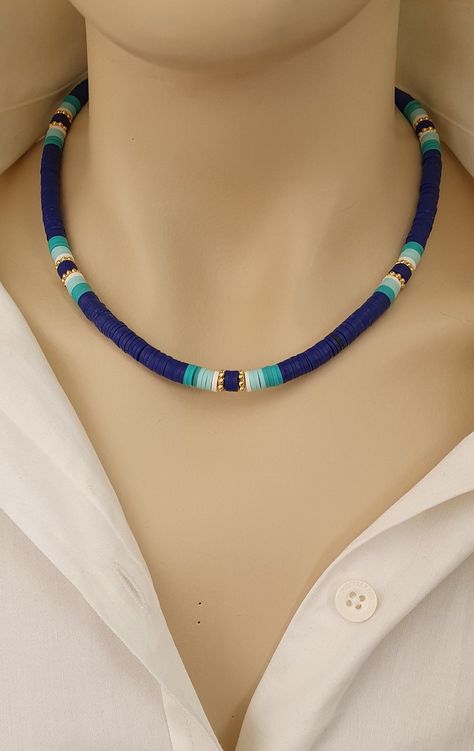 Navy blue surfer style choker Add a boho-style touch to any outfit with this heishi bead necklace. With its navy blue color scheme and gold accents, it's sure to make you look your best. This multicolored heishi bead choker necklace will give you a beachy bohemian look. Pair this with your favorite bohemian embroidered maxi skirt and a sleeveless top for a stylish summer outfit. 43cm+5cm. Adjustable length 👉 It is made of anti-allergic quality material, with gold-plated non-tarnish golden intermediate decor, heishi bead decoration on a steel wire, and 24-carat gold-plated lobster claw closure. 👉 As long as proper care conditions are provided, it does not darken for a long time and is hypoallergenic 💥Lady's Gift, Daily Necklace, Stylish Start, Girl's Birthday Gift, Lucky Gift, Gift for M Fimo Necklace, Heishi Jewelry, Polymer Clay Beaded Necklace, قلادات متدلية, Fimo Beads, Clay Bead Necklace, Heishi Necklace, Surfer Style, Beaded Necklace Designs