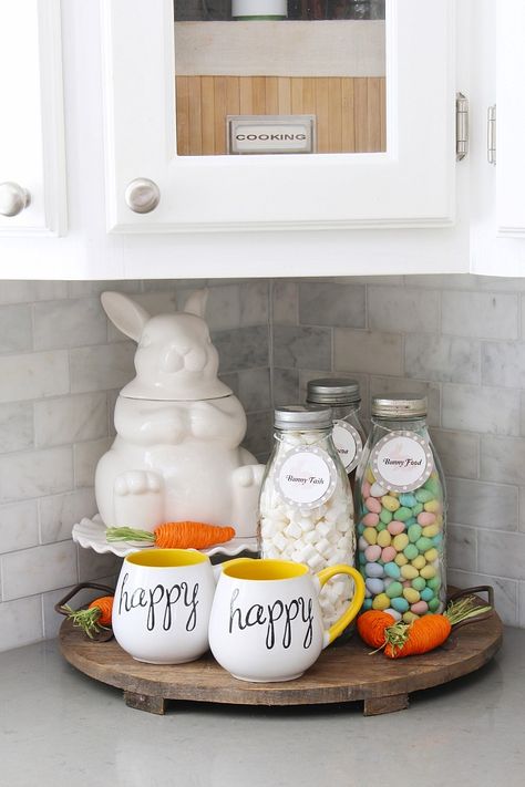 Easter hot chocolate bar with a white ceramic bunny cookies jar and milk bottles. Easter Countertop Decor, Hot Chocolate Bar Labels, Easter Hot Chocolate, Easter Kitchen Decor, Chocolate Bar Labels, Easter Centerpieces Diy, Cookies Jar, Spring Kitchen Decor, Bunny Dishes