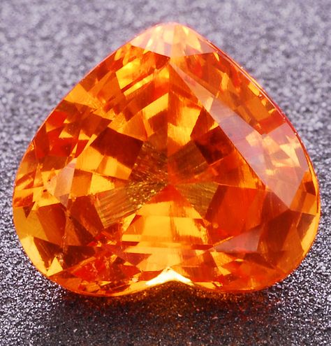 Spessartite garnet is ideochromatic, meaning it is colored by a fundamental element in its composition. That element is manganese, which produces an orange color. Without the manganese, the stone would no longer be spessartite  (Mandarin garnet) Energy Stones Crystal Healing, Gemstone Art, Spessartite Garnet, Faceted Gems, Garnet Jewelry, Jewelry Designers, Rare Gems, Rocks And Gems, Minerals And Gemstones