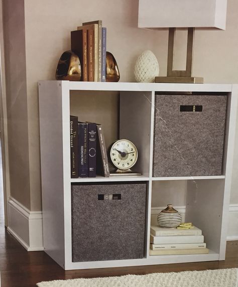 Living room. 4-cube white organizer. #target Cube Organizer Night Stand Ideas, 4 Cube Organizer Ideas Living Room, Cube Storage Tv Stand Bedroom, Cube Organizer Nightstand, 4 Cube Organizer Ideas, Aesthetic Cube Shelves, White Organizer, 4 Cube Organizer, Bedroom Storage Cube’s Box