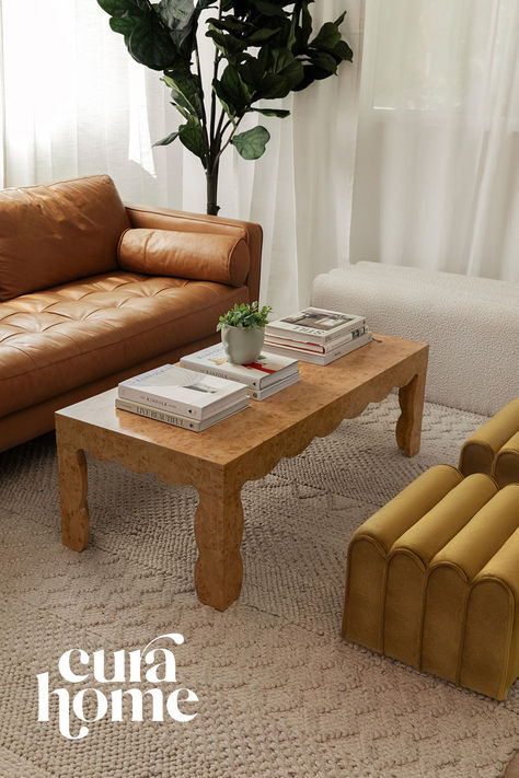 Modern living room style featuring a faux burl scallop-edged coffee table styled with decor books and a small planter. Vintage Inspired Coffee Table, Padded Table, Future Mood, Coffee Tables Ideas, Burled Wood Coffee Table, Ny Apartment, Coffee Table Living Room, Drawer Desk, Coffee Table Styling