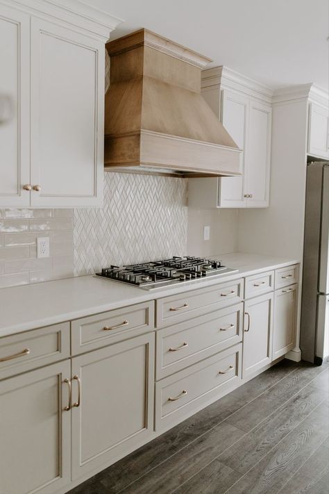 Classic natural kitchen: olive cabinets, stovetop, and wood-stained range hood. Olive Cabinets, Modern Kitchen Hood, Kitchen Hood Ideas, Olive Kitchen, Kitchen Hood Design, Earthy Modern, Kitchen Vent Hood, New Drink, Natural Wood Kitchen