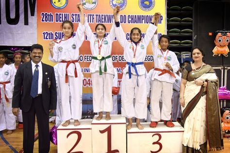 Mrs. Gupta graced the 12th Delhi State Sub Junior Taekwondo championship, held at Thyagraj Sports Stadium, as the Chief Guest. She applauded the participants and acknowledged the huge participation of students in the championship. She congratulated the winners and acknowledged them with medals and trophies. She encouraged them to follow good sportsmanship as a practice of etiquette and respect in sports and to follow this trait into other aspects of life as well. Medals And Trophies, Good Sportsmanship, Sports Stadium, Waist Workout, Taekwondo, Slim Waist, Thing 1 Thing 2, Karate, Abc