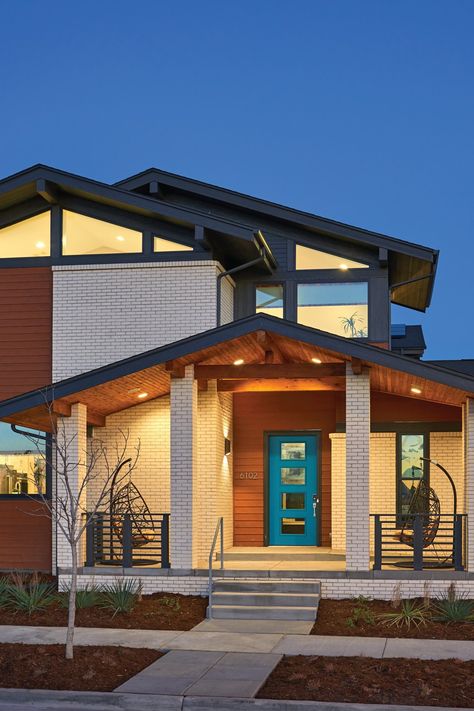 Boulder, CO | A teal front door makes a statement on this mid-century modern-style home | Andersen 100 Series Picture Windows Mid Century Farmhouse Exterior, Mid Century Modern Windows Exterior, Midcentury Home Exterior, Mid Century Windows, Mid Century Modern Front Porch, Mid Century Modern Porch, Midcentury Modern Front Door, Teal Front Door, Mid Century Modern Homes Exterior