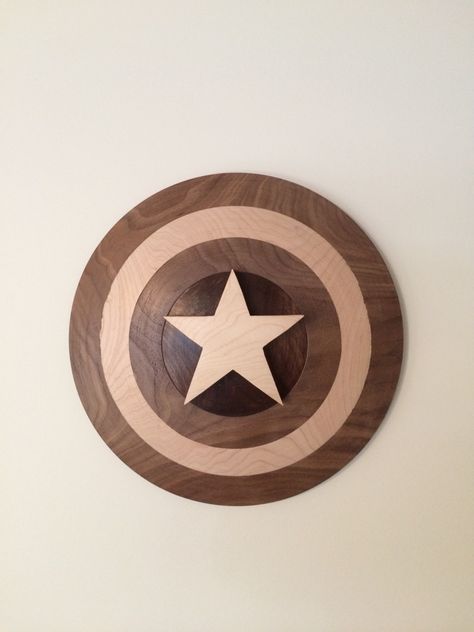 Captain America shield turned on the lathe with walnut and maple. Wooden Shield Diy, Marvel Wood Projects, Rorys Room, Marvel Diy, Wood Flags, American Flag Art, Wooden Shield, Pallet Furniture Designs, Captain America Costume