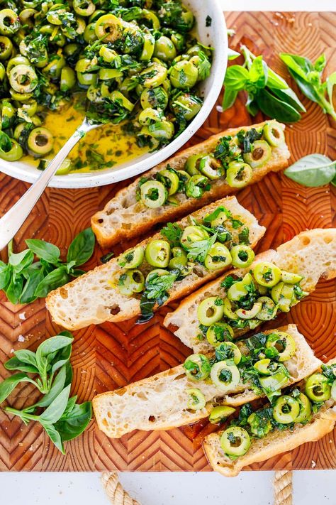 This green olive tapenade is made with buttery Castelvetrano olives, loads of fresh herbs, lemon zest, garlic, and Aleppo chili flakes bathed in extra virgin olive oil. Your focaccia bread will thank you. Best Focaccia Bread, Best Focaccia, Olive Recipes Appetizers, Green Olive Tapenade, Homemade Focaccia Bread, Castelvetrano Olives, Focaccia Bread Recipe, Elegant Food, Olive Recipes