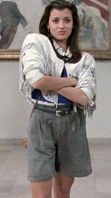 Sloane Peterson's iconic white, fringe, leather jacket embodies the essence of 80s style in "Ferris Bueller's Day Off." Ferris Bueller Costume, Sloane Peterson, White Fringe Leather Jacket, 80s Halloween Costumes, 90s Fashion For Women, Mia Sara, Ferris Bueller’s Day Off, Ferris Bueller's Day Off, 90s Fashion Women