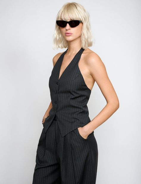 FINAL SALE Halter pinstripe button vest with fitted waist darts. Styled with matching pinstripe trousers. Brand Pixie MarketSize XS bust 32" waist 24"Size S bust 34" waist 26"Size M bust 36",waist 28"Size L bust 38", waist 30"57%Polyester 23%wool, 20% rayonLined in 100% polyesterFitted Model is wearing a size small her usual size.Imported Waist Coat Vest Women Outfits, Pinstripe Vest Outfit, Tailored Vest Outfits For Women, Waist Coat Outfit, Waist Coat Outfit Women, Classic Edgy Outfits, Edge Outfits, Edgy Concert Outfit, Edgy Outfits Grunge