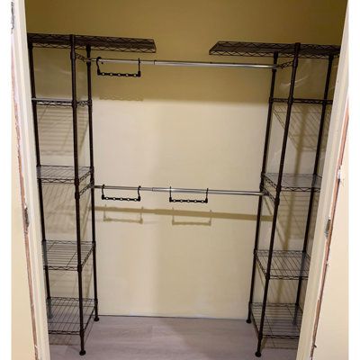 Five shelves per tower with plastic shelving liners included Two towers with extendable clothing racks to custom-fit your closet Winston Porter Color: Bronze | Winston Porter Forontenac Steel Armoire 72.0 H x 80.0 W x 14.0 D in brownMetal in Bronze | 72" H X 80" W X 14" D | Wayfair Pants Organization Closet, Reach In Closet Organization, Small Clothes Closet Organization, Closet Redesign, Shelves Brown, Rack Wardrobe, Small Closet Storage, Small Closet Organization Bedroom, Closet Solutions