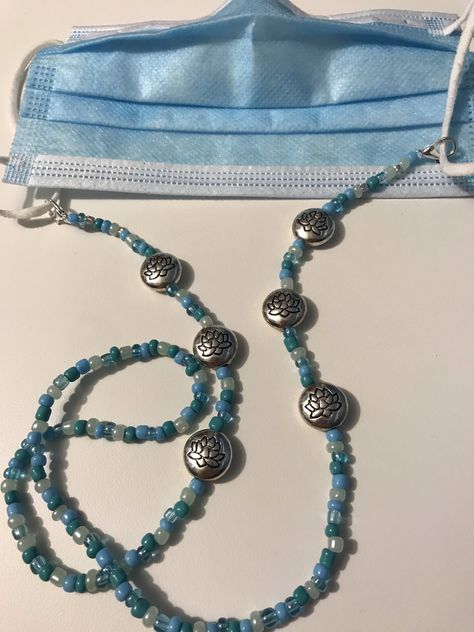 Excited to share this item from my #etsy shop: Lotus medallions and blues colored beads mask holder, Mask holder chains, 28 inches look towards the hope of Spring. Face Mask Holder, Fish Beads, Mask Lanyard, Mask Holder, Crazy Socks, The Hope, Gifts For Wedding Party, Badge Holders Lanyard, Bridal Accessories